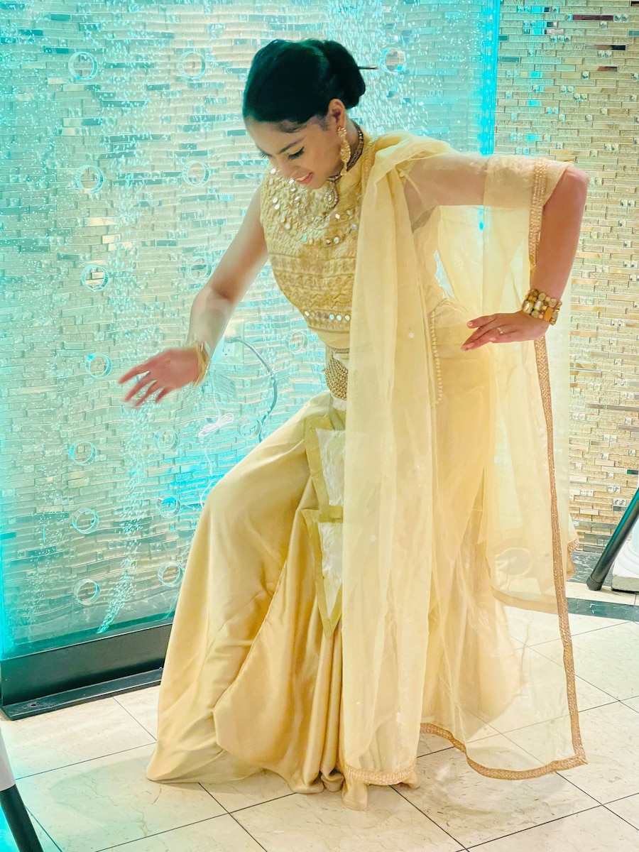 Airman 1st Class Theja R. Ranasingha Randhunu Mudhiyanselage, a finance customer service specialist with the 78th Comptroller Squadron, at Robins Air Force Base, Georgia, performs a Sri Lankan cultural dance in April 2023 at her family member’s wedding celebration in New York. (Courtesy Photo)