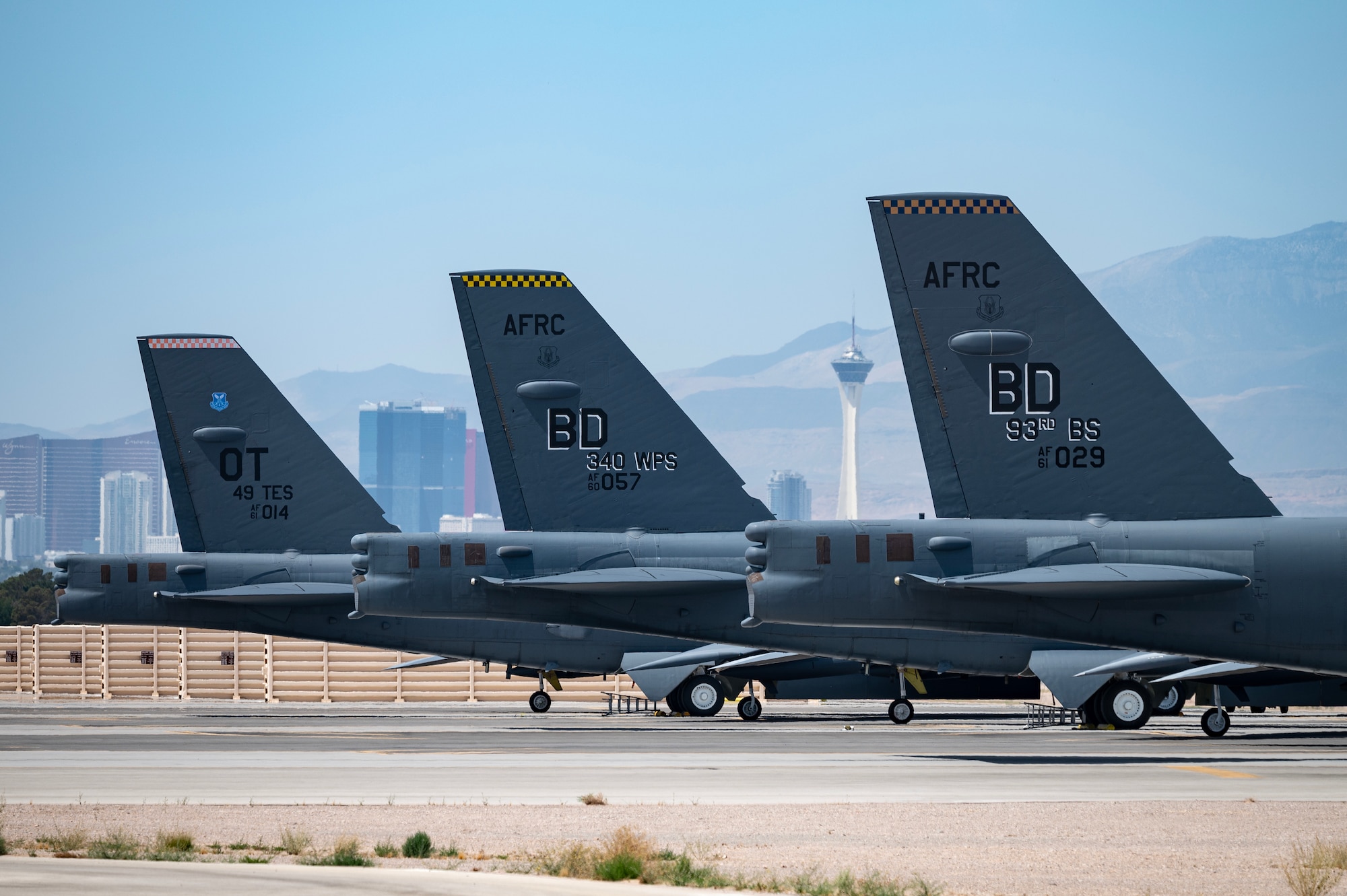 Three B-52 Stratofortress bombers sit on the ramp at Nellis Air Force Base, Nevada, May 31, 2023. The B-52s are at Nellis in support of the Weapons School Integration exercise. The U.S. Air Force Weapons School teaches graduate-level instructor courses that provide advanced training in weapons and tactics employment to officers and enlisted specialists of the combat and mobility air forces. (U.S. Air Force photo by William R. Lewis)