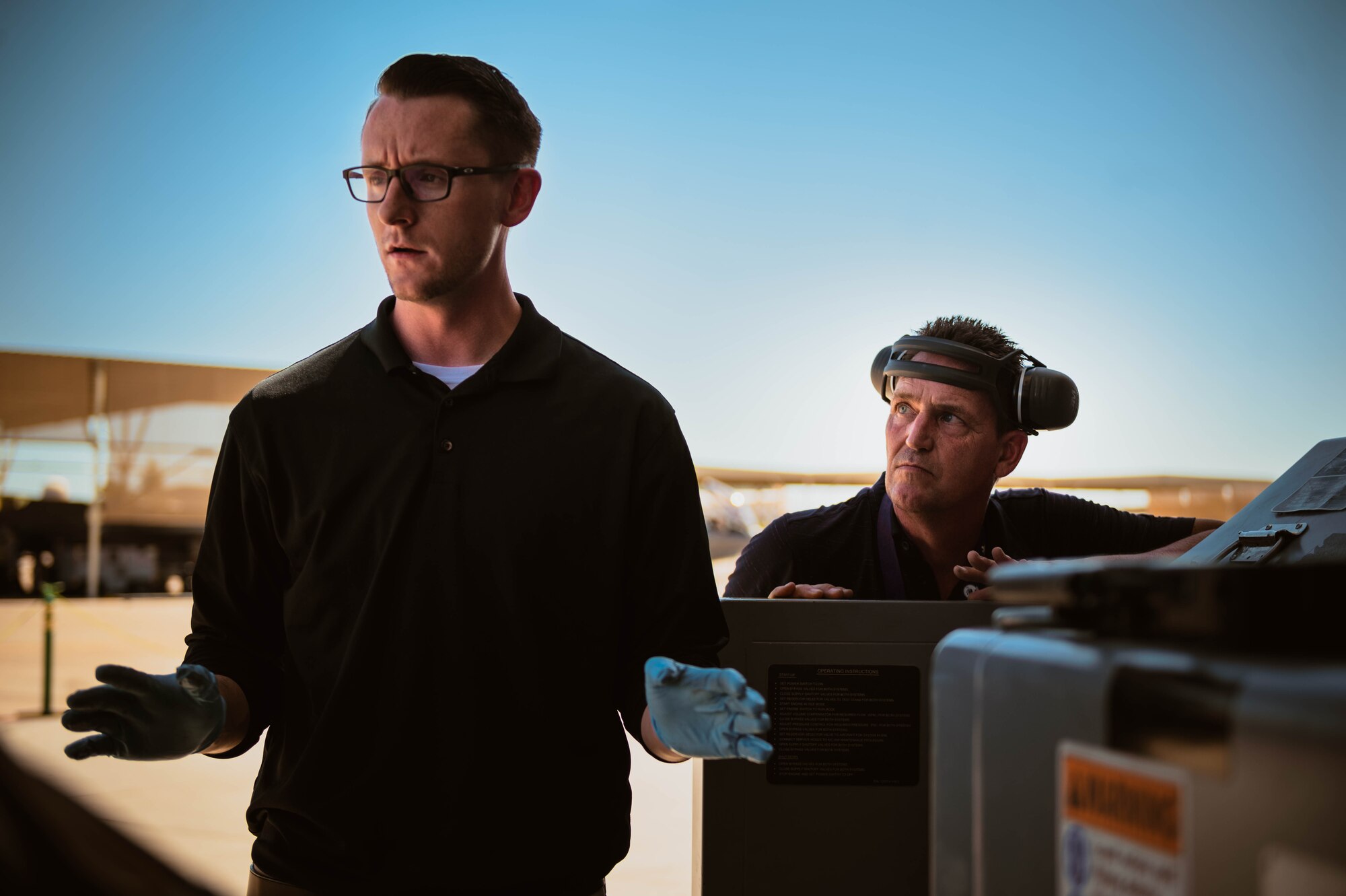 Nelson Bergemann (left), 56th Maintenance Group Air Force Engineering Technical Services avionics senior equipment specialist and Gary Bayer (right), 56th MXG AFETS airframe senior equipment specialist, conduct diesel hydraulic cart training.