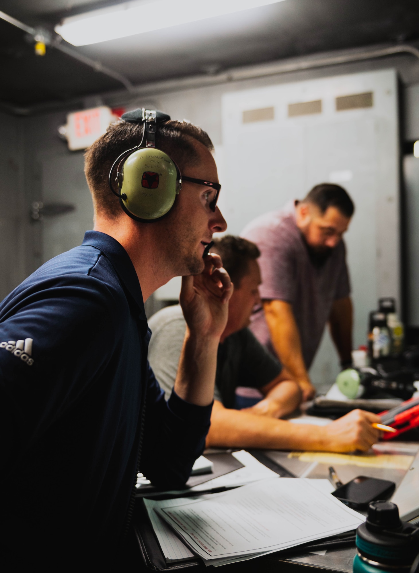 Nelson Bergemann (left), Gary Bayer (middle), and Jose Flores (right), 56th Maintenance Group Air Force Engineering Technical Services specialists, conduct installed engine operation certification.