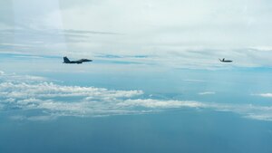 An F-15E Strike Eagle from the 96th Test Wing’s 40th Flight Test Squadron at Eglin AFB, Florida flies in formation with an XQ-58A Valkyrie flown by artificial intelligence agents developed by the Autonomous Air Combat Operations, or AACO, team from AFRL. The algorithms matured millions of hours in high fidelity AFSIM simulation events, 10 sorties on the X-62 VISTA, Hardware-in-the-Loop events with the XQ-58A, and ground test operations. (U.S. Air Force photo)