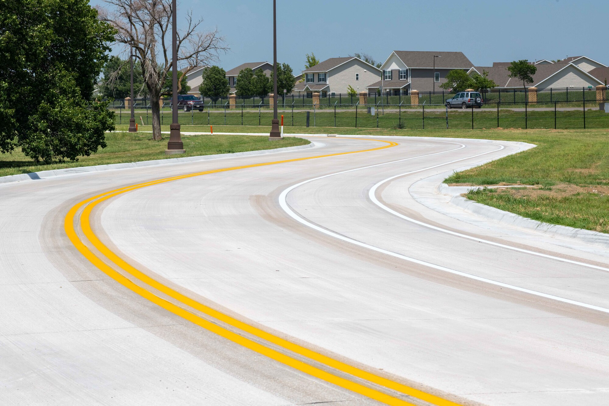 After eight months of diligent efforts, McConnell Air Force Base has successfully completed the reconstruction of Wichita Street, a significant thoroughfare within the base premises July 28, 2023, at McConnell Air Force Base, Kansas. As part of the commitment to environmental stewardship, the reconstruction project incorporated sustainable practices, including the planting of 46 trees and the strategic placement of riprap, a type of rubble, to prevent erosion. (U.S. Air Force photo by Staff Sgt. Adam Goodly)