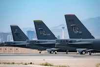 Three B-52 Stratofortress bombers sit on the ramp at Nellis Air Force Base, Nevada, May 31, 2023. The B-52s are at Nellis in support of the Weapons School Integration exercise. The U.S. Air Force Weapons School teaches graduate-level instructor courses that provide advanced training in weapons and tactics employment to officers and enlisted specialists of the combat and mobility air forces. (U.S. Air Force photo by William R. Lewis)