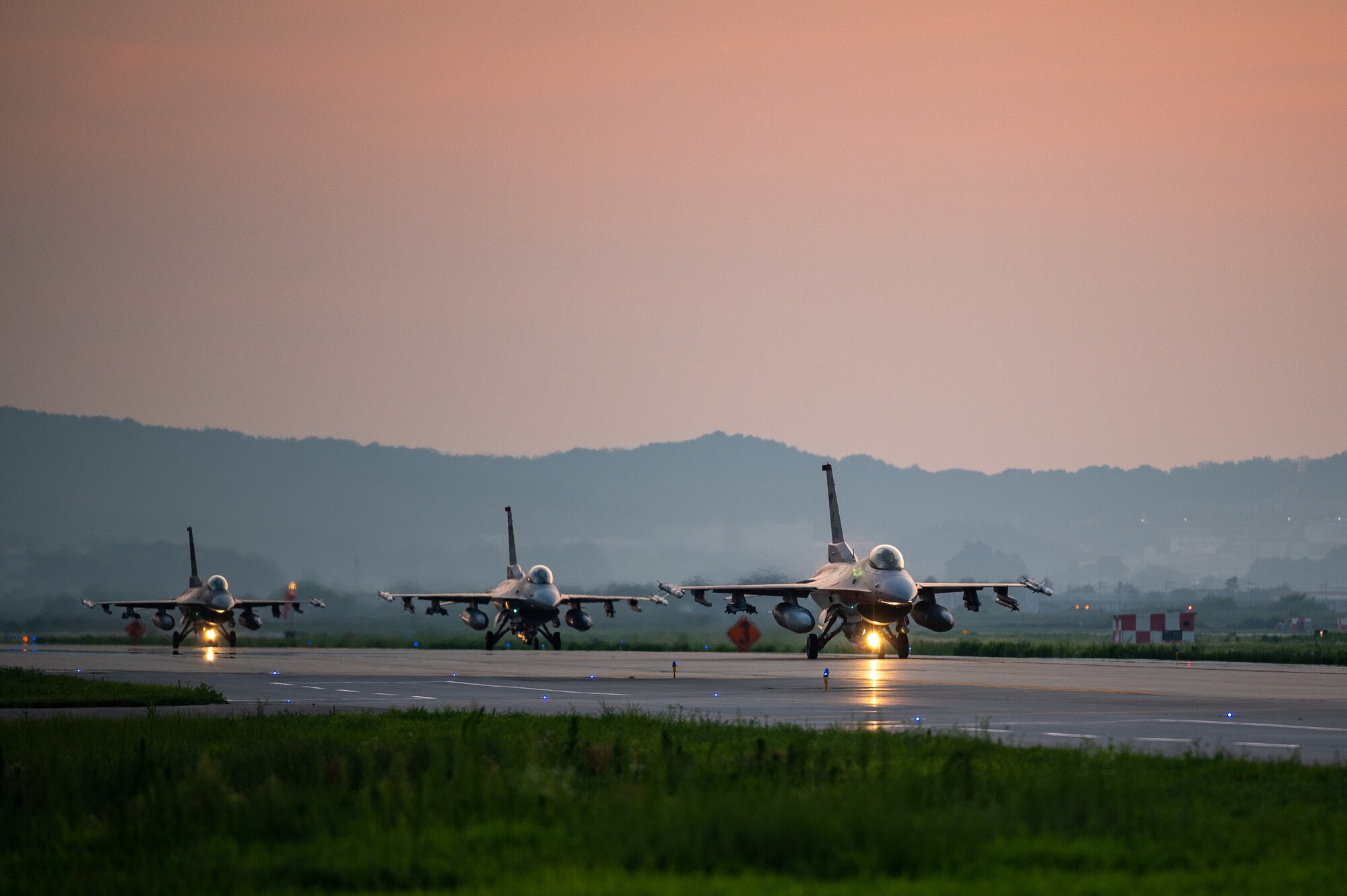 U.S. Air Force F-16 Fighting Falcon’s assigned to the 51st Fighter Wing, taxi down an Alternate Landing Surface at Osan AB, Republic of Korea, Aug. 1, 2023. The F-16, a highly versatile and agile multi-role fighter aircraft, is renowned for its exceptional performance and capabilities. Throughout the training event, the ALS allowed the aircraft to deploy while simulating a partially damaged runway. (U.S. Air Force photo by Staff Sgt. Thomas Sjoberg)
