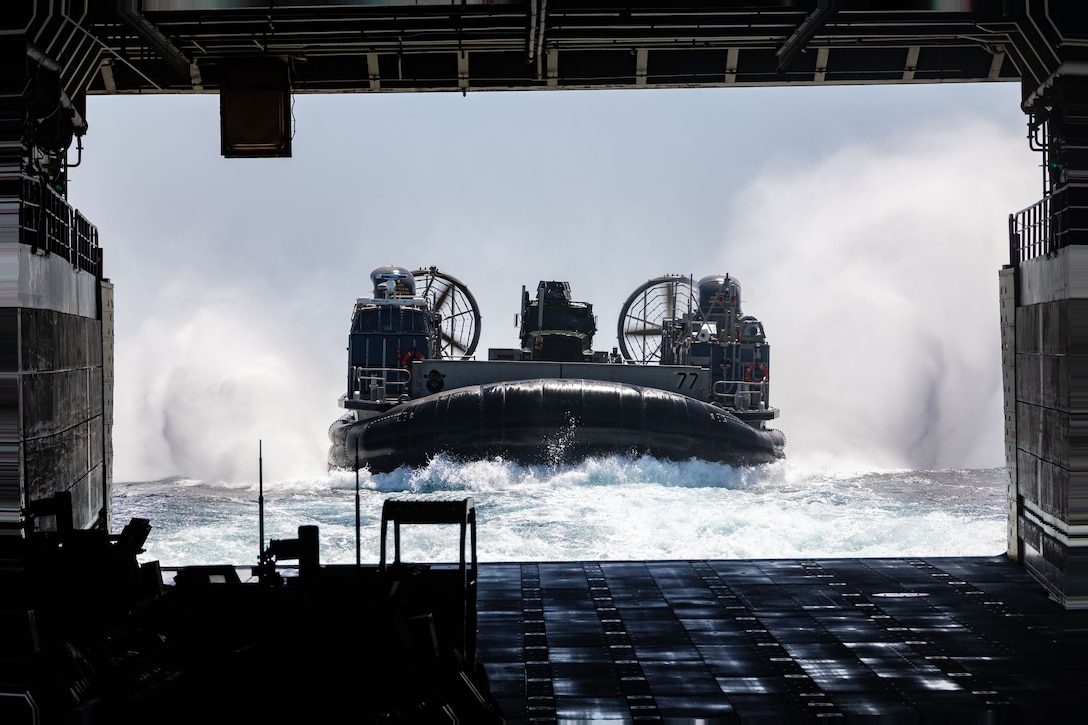 A U.S. Navy LCAC enters the well deck of the San Antonio class amphibious transport docking ship USS Mesa Verde (LPD 19) on the Atlantic Ocean, July 25, 2023. The USS Mesa Verde (LPD-19), assigned to the Bataan Amphibious Ready Group and embarked 26th Marine Expeditionary Unit (Special Operations Capable), under the command and control of Task Force 61/2, is on a scheduled deployment in the U.S. Naval Forces Europe area of operations, employed by U.S. Sixth Fleet to defend U.S., allied and partner interests. (U.S. Marine Corps photo by Cpl. Michele Clarke)