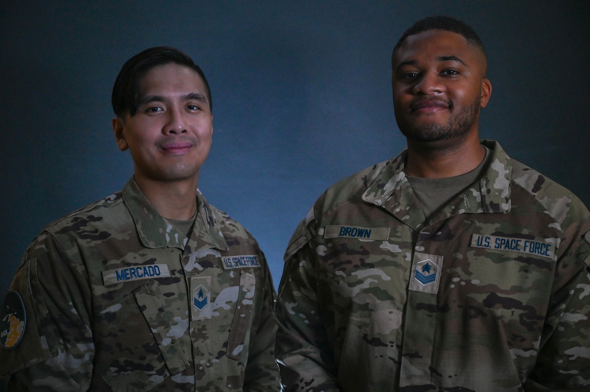 U.S. Space Force Sgt. Marcoricardo Mercado, 645th Cyberspace Squadron defensive cyber operations supervisor and U.S. Space Force Sgt. Dwight Brown, 645th Cyberspace Squadron defensive cyber operations supervisor, poses for a photo at Patrick Space Force Base, Florida, July 5, 2023. The 645th Cyberspace Squadron supports Space Launch Delta 45 by working closely with intel and other agencies to identify and prevent advanced, persistent threats interfering with launch capabilities. (U.S. Space Force photo by Senior Airman Samuel Becker)