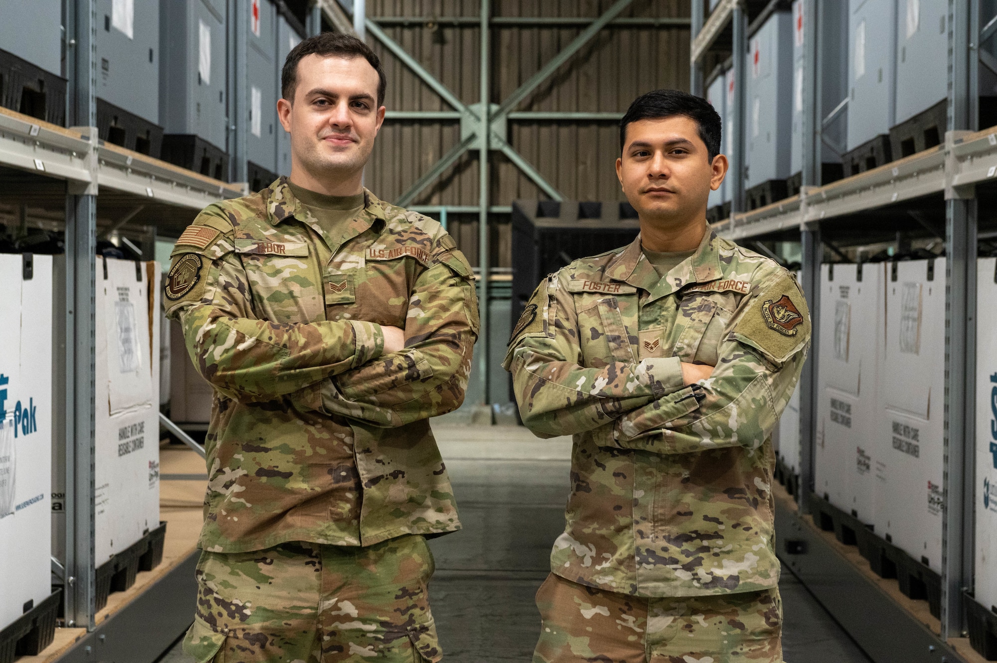 Two service members pose for a photo.