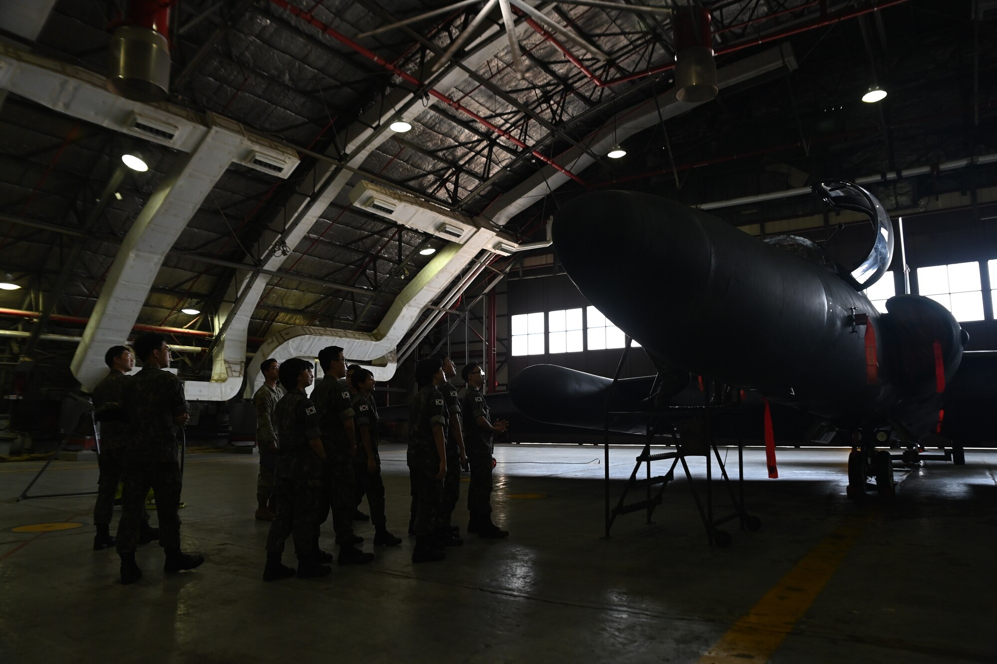 Republic of Korea Air Force interpretation officers in training observe a U-2S Dragon Lady static display during an immersion tour at Osan Air Base, ROK, July 25, 2023.