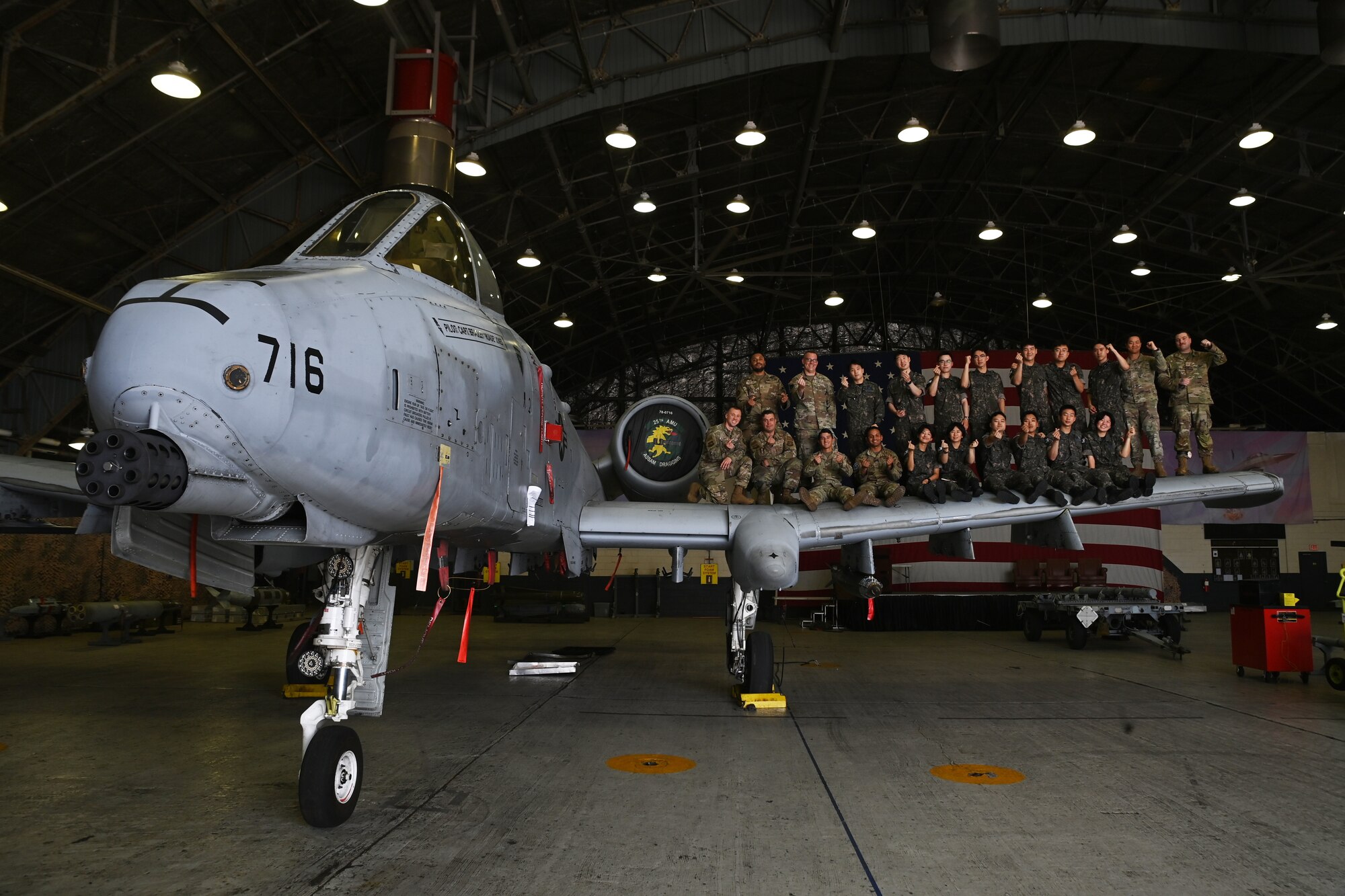 U.S. Air Force 51st Maintenance Group Airmen and Republic of Korea Air Force interpretation officers in training pose for a group photo during an immersion tour at Osan Air Base, ROK, July 25, 2023.