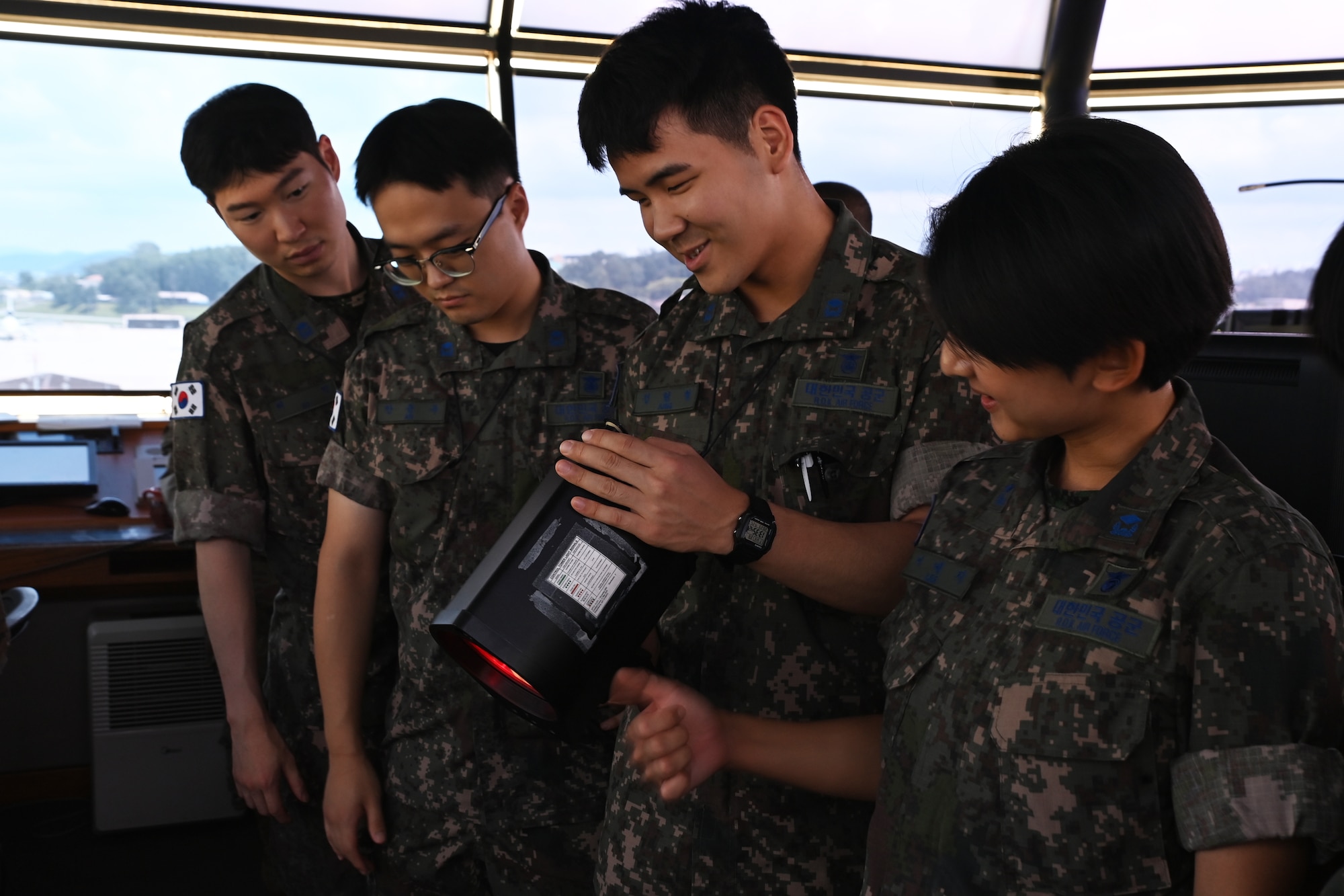 Republic of Korea Air Force interpretation officers in training learn about U.S. Air Force air traffic controllers and their duties during an immersion tour at Osan Air Base, ROK, July 25, 2023.