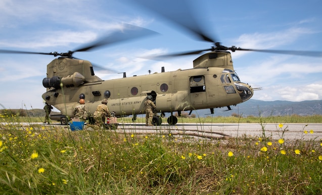 U.S. Army CH-47F Chinook helicopter assigned to 1st Battalion, 214th Aviation Regiment (General Support Aviation Battalion, 12th Combat Aviation Brigade, lands for fuel at a forward arming and refueling point (FARP) established by 12CAB Soldiers in support of Exercise Swift Response 23 on Stefanovikeio Airbase, Greece, May 13, 2023. DEFENDER 23 is a U.S. Army Europe and Africa led exercise focused on the strategic deployment of continental United States-based forces, employment of Army Prepositioned Stocks, and interoperability with Allies and partners. Taking place from 22 April to 23 June, DEFENDER 23 demonstrates USAREUR-AF’s ability to aggregate U.S.-based combat power quickly in Eastern Europe, increase lethality of the NATO Alliance through long-distance fires, build unit readiness in a complex joint, multi-national environment, and leverage host nation capabilities to increase USAREUR-AF’s operational reach. DEFENDER 23 includes more than 7,800 U.S. and 15,000 multi-national service members from more than 20 nations who will participate including, but not limited to: Estonia, France, Germany, Greece, Italy, Latvia, Poland, Portugal, Romania, Spain, United Kingdom and the United States. (U.S. Army photo by Capt. Gabrielle Hildebrand)