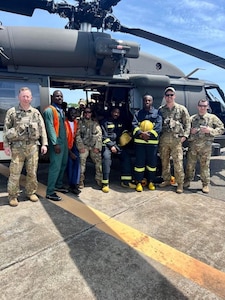 U.S. Army Soldiers assigned to Charlie Company, 1st Battalion, 214th Aviation Regiment (General Support Aviation Battalion), 12th Combat Aviation Brigade, pose for a photo with Ghanian airport staff in Accra, Ghana, March 26, 2023. 12 CAB Soldiers were deployed to Ghana as part of U.S. Africa Command’s support for Vice President Kamala Harris’ recent trip to Africa. (U.S. Army photo by Chief Warrant Officer 3 Ryan Becker)