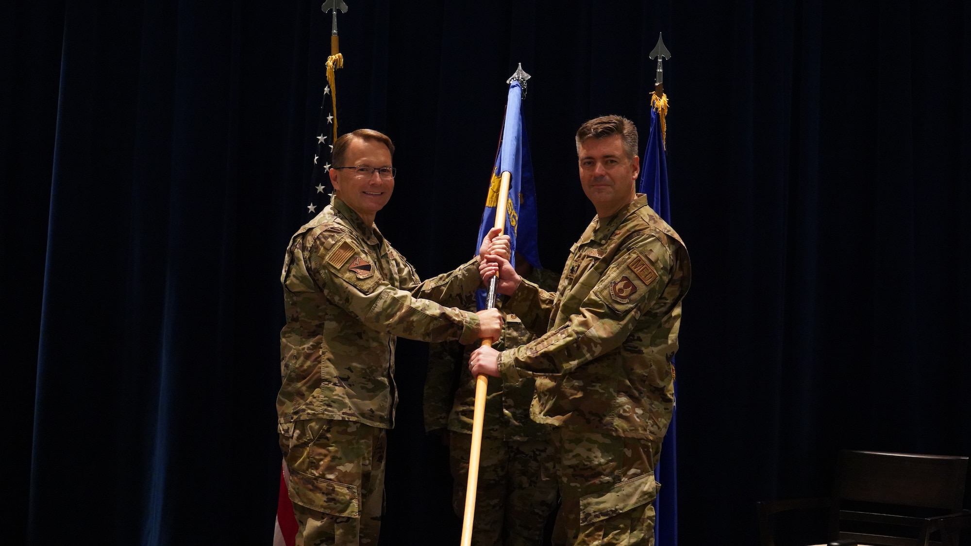 Harrell presents the 88th Surgical Operations Squadron guidon to Gavitt.