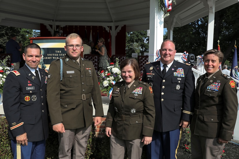 U.S. Army Spc. Isaac Junkin, second from left, of Bravo Company, 1st Battalion, 112th Infantry Regiment, 56th Stryker Brigade Combat Team, poses with Brig. Gen. Laura McHugh, center, deputy adjutant general- Army, and other Pennsylvania National Guard graduates of the U.S. Army War College after accepting the certificate for a master’s degree in strategic studies on behalf of his father Lt. Col. Francisco Junkin,who passed away April 8, 2023. (U.S. Army National Guard photo by Sgt. 1st Class Zane Craig)