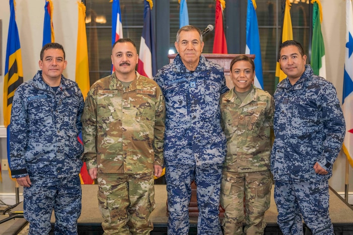 Language Enabled Airman Program Scholars Chief Master Sgt. Juan Alvarez and Master Sgt. Karina Gonzalez interact with the Commander of the Mexican Air Force and Mexican Air Force Senior Enlisted Leader. (U.S. Air Force photo by Tech. Sgt. Kenneth New)