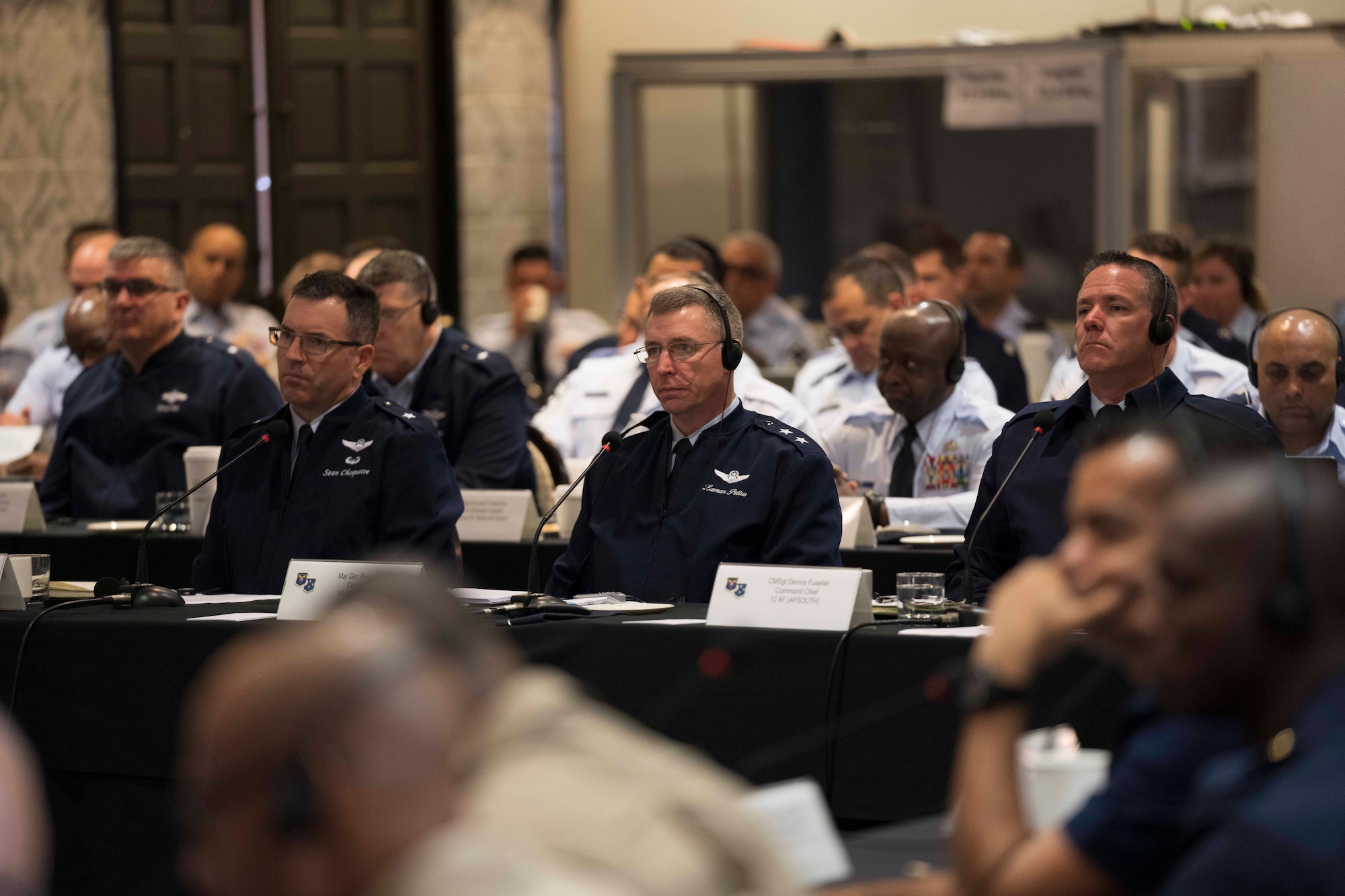 Air Forces Southern Command Team (from left to right, Brig. Gen. Sean Choquette, Maj. Gen. Evan Pettus, and Chief Master Sgt. Dennis Fuselier) listen as partner nation leaders brief their perspectives on topics of strategic regional importance (U.S. Air Force photo by Tech. Sgt. Kenneth New)