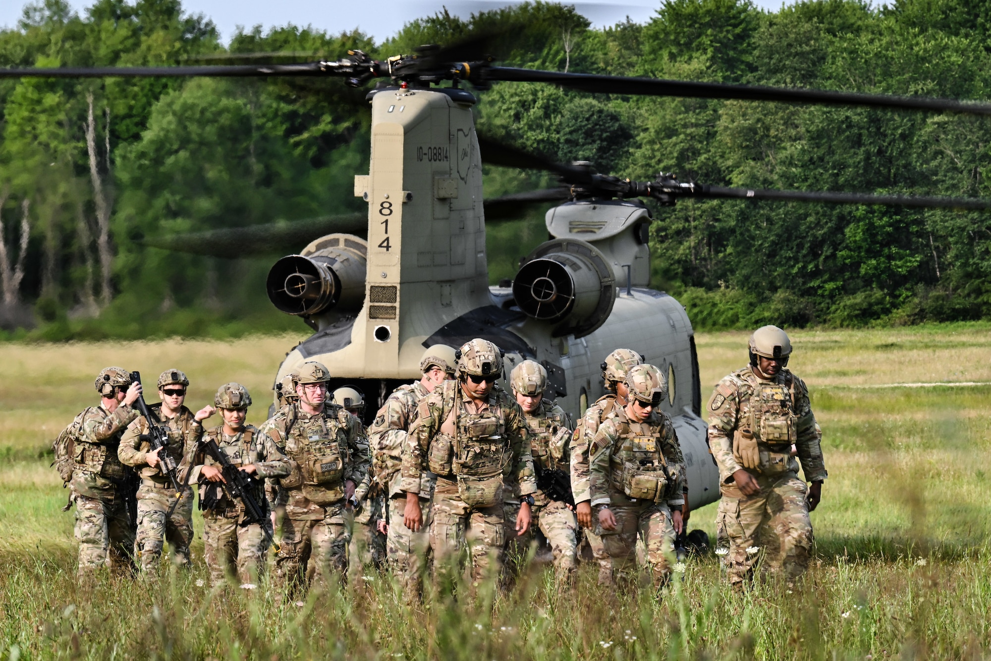 Air Force Reserve Command Security Forces Defenders disembark an Ohio National Guard CH-47 Chinook helicopter on July 25, 2023, at Camp James A. Garfield Joint Military Training Center, Ohio.