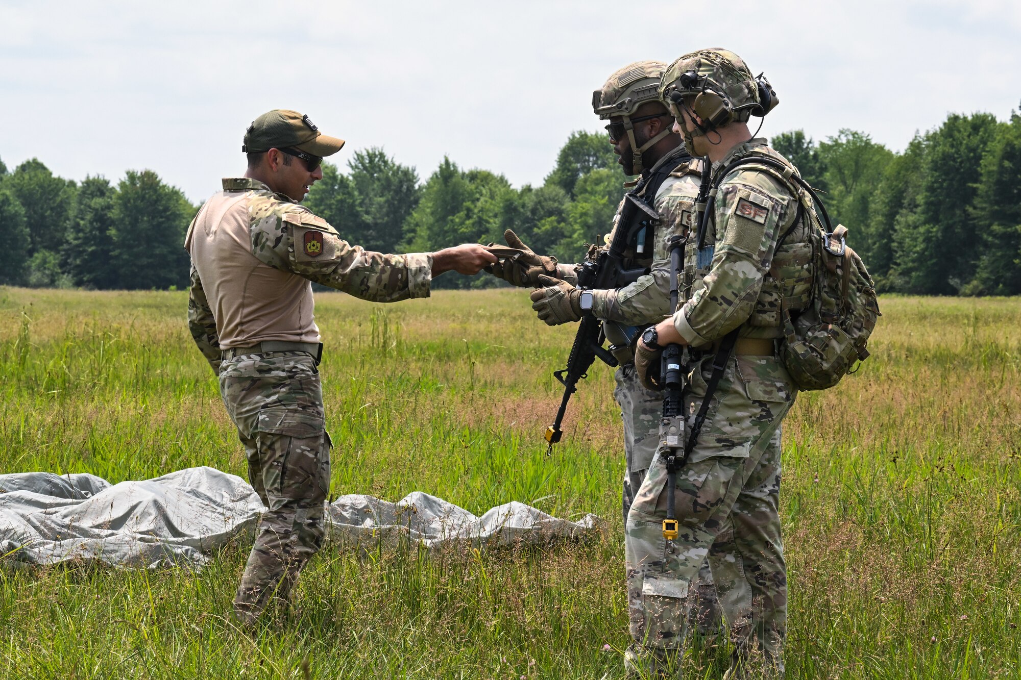 Air Force Reserve Command Security Forces Defenders interact with a simulated civilian, July 25, 2023, at Camp James A. Garfield Joint Military Training Center, Ohio.