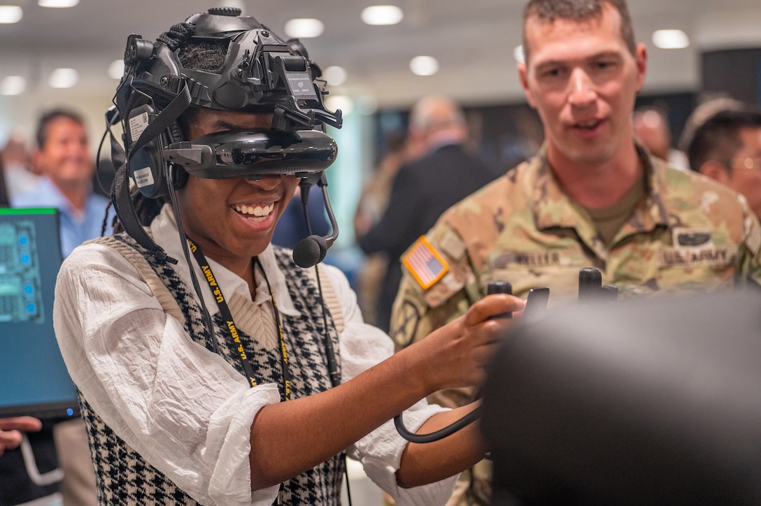 A person wears a virtual reality headset during a technology demonstration.