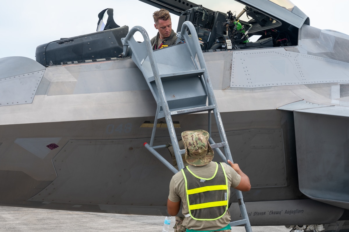 A U.S. Air Force Airman assists the pilot of an F-22 Raptor in deplaning during Cope Thunder 23-2 at Clark Air Base, Philippines, July 7, 2023. Bilateral training exercises like Cope Thunder 23-2 helped to reinforce the U.S.’ commitment to peace and prosperity in the region.