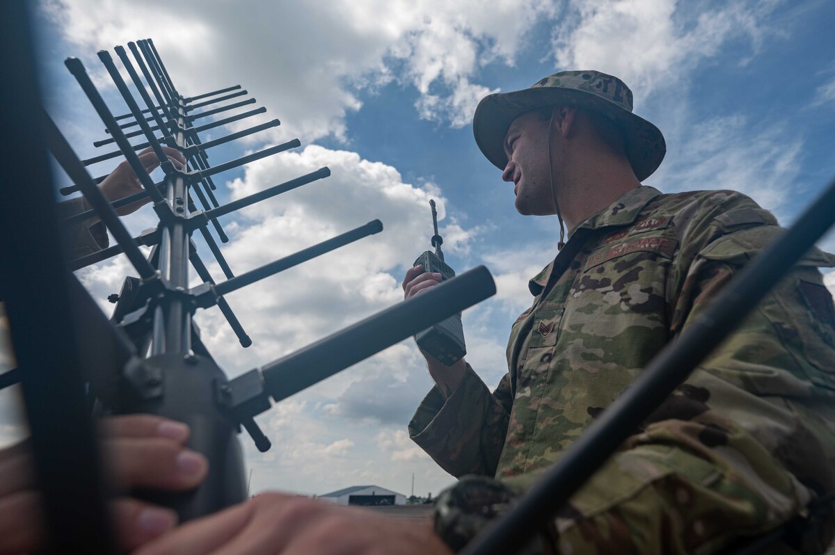U.S. Air Force Staff Sgt. Dustin Bennett, 355th Communication Squadron cyber defense operation technician, uses a portable radio communication-152 during Cope Thunder 23-2 on the South ramp of Clark Air Base, Philippines, July 11, 2023. Cope Thunder 23-2 was an exercise with the goal to improve regional security and protect a free and open Indo-Pacific. (U.S. Air Force photo by Airman 1st Class Jhade Herrera)