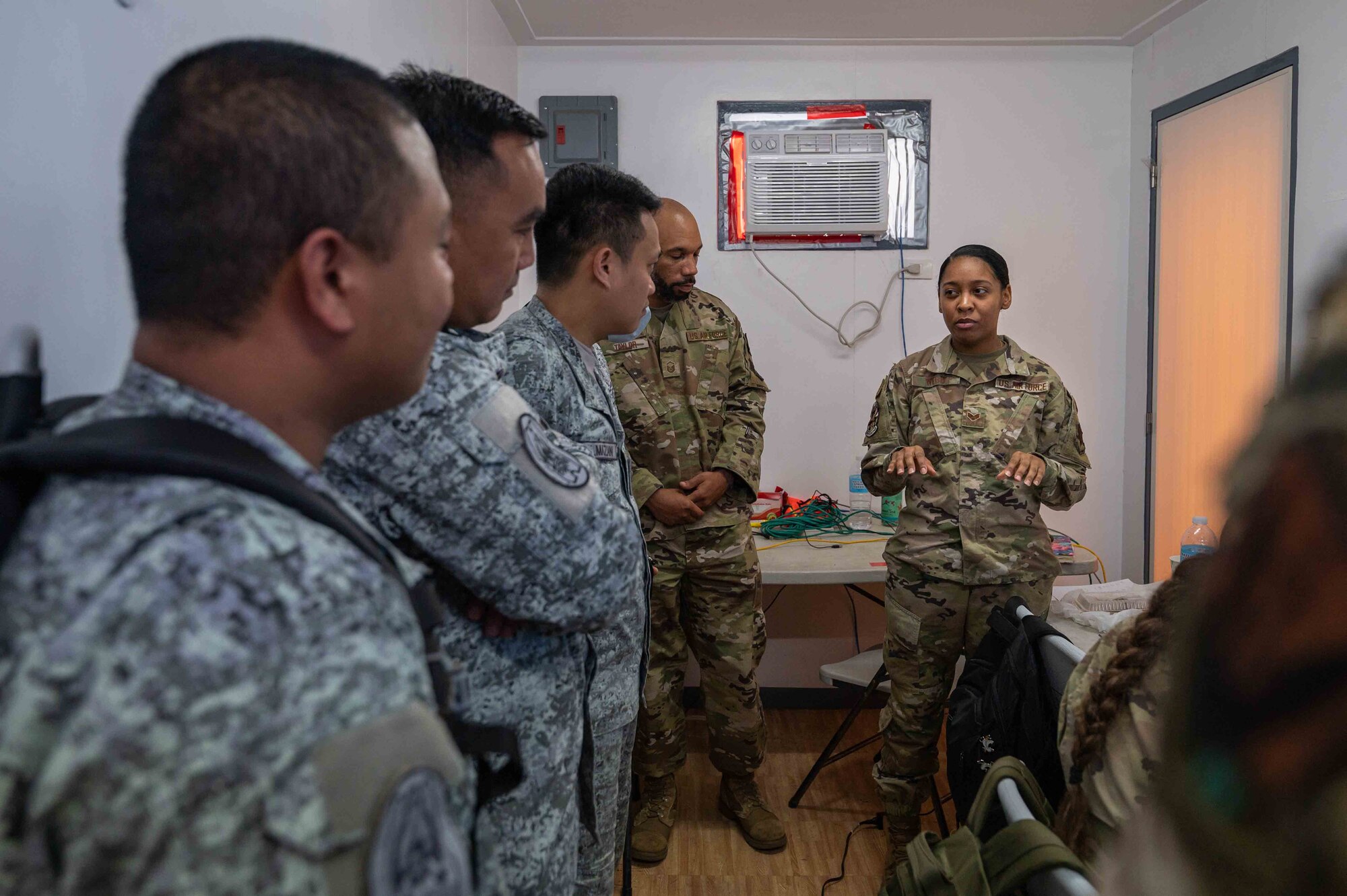 U.S. Air Force personnel brief Philippine Air Force personnel during exercise Cope Thunder 23-2 on the South ramp of Clark Air Base, Philippines, July 11, 2023. Exercises like these enhance capability and interoperability, while strengthening trust between like-minded nations to ensure the air, maritime, cyber, and space domains remain open to all nations. (U.S. Air Force photo by Airman 1st Class Jhade Herrera)