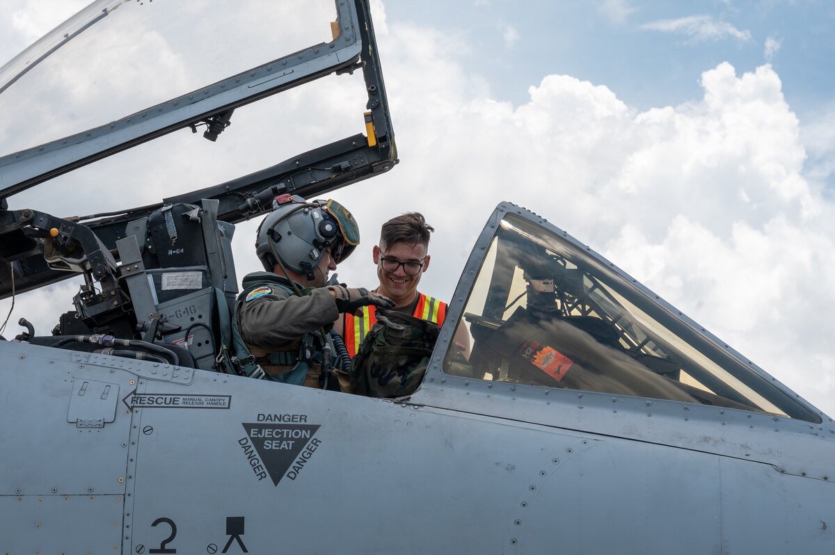 A U.S. Air Force Airman, assigned to Davis-Monthan Air Force Base, Arizona helps a pilot with his gear in support of Cope Thunder 23-2 at Mactan, Philippines, July 11, 2023. Cope Thunder 23-2 provided a unique opportunity for the service members to train together, increasing the U.S.’ and the Philippines’ ability to work together.
