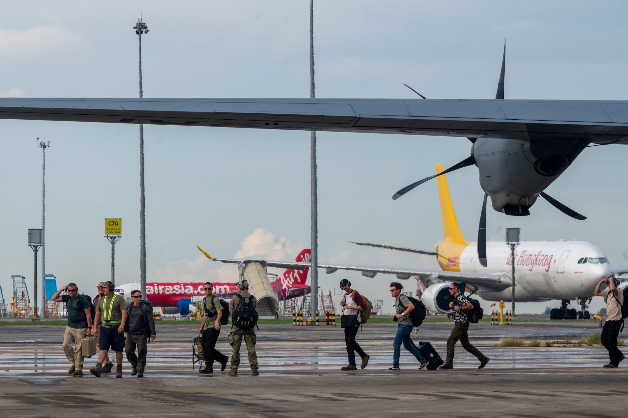 U.S. Air Force Airmen, assigned to Davis-Monthan Air Force Base, Arizona depart a C-130 Hercules in support of Cope Thunder 23-2 at Mactan, Philippines, July 11, 2023. Cope Thunder 23-2 was an exercise with the goal to improve regional security and protect a free and open Indo-Pacific.