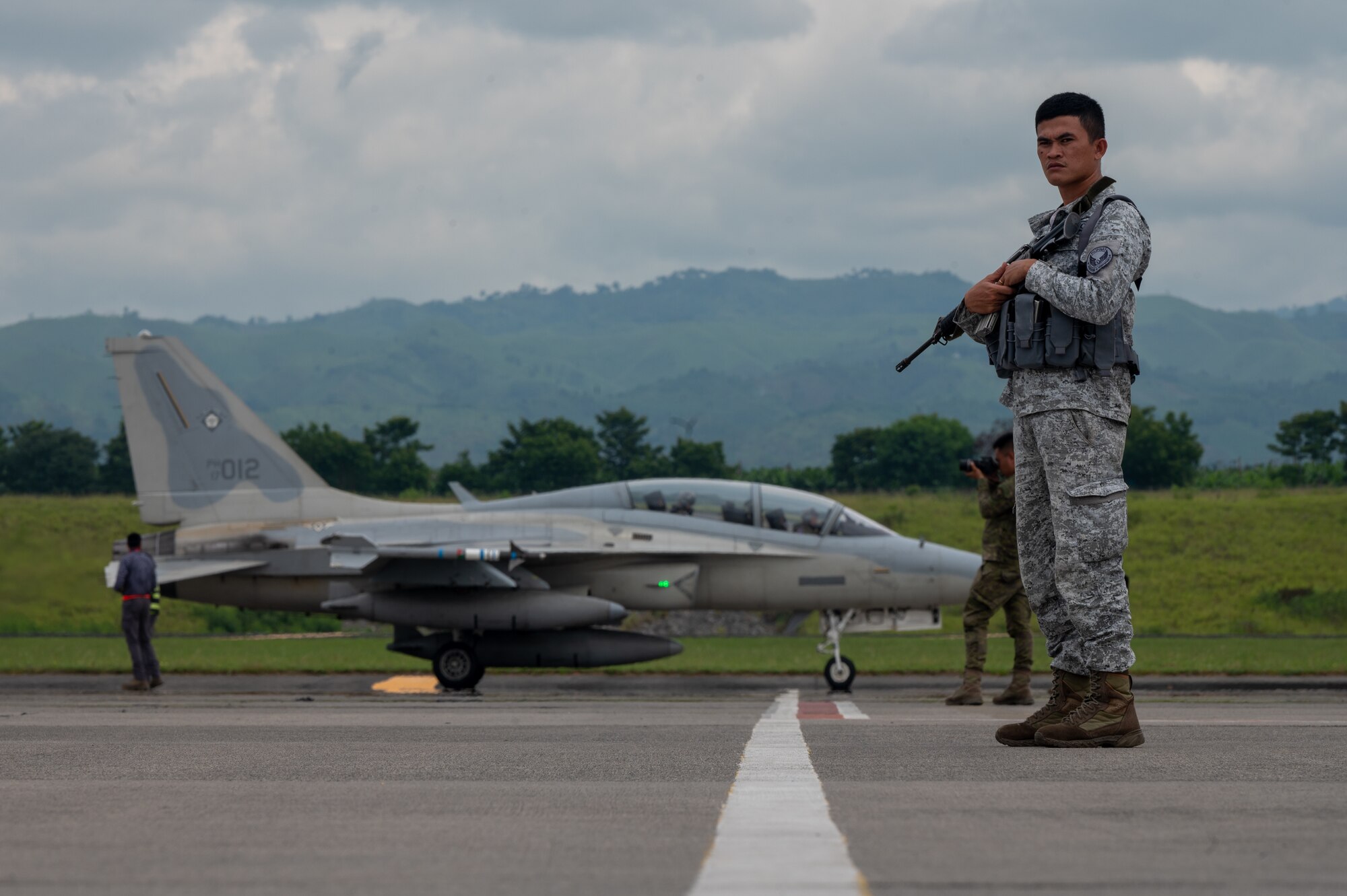 A Philippine Air Force member provides security in support of Cope Thunder 23-2 at General Santos International Airport, Philippines, July 11, 2023. The movement to Gen Santos was a huge success with the Philippines leveraging agile combat employment capabilities. (U.S. Air Force photo by Senior Airman Vaughn Weber)