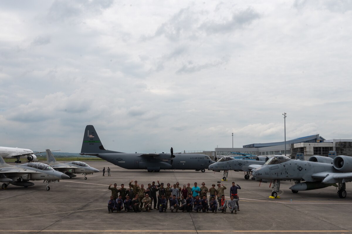 U.S. Air Force Airmen, assigned to Davis-Monthan Air Force Base, Arizona along with Philippine Air Force members pose for a group photo during Cope Thunder 23-2 at General Santos International Airport, Philippines, July 11, 2023. The movement to Gen Santos was one of the first times the U.S. leveraged agile combat employment capabilities successfully in the Philippines. (U.S. Air Force photo by Senior Airman Vaughn Weber)