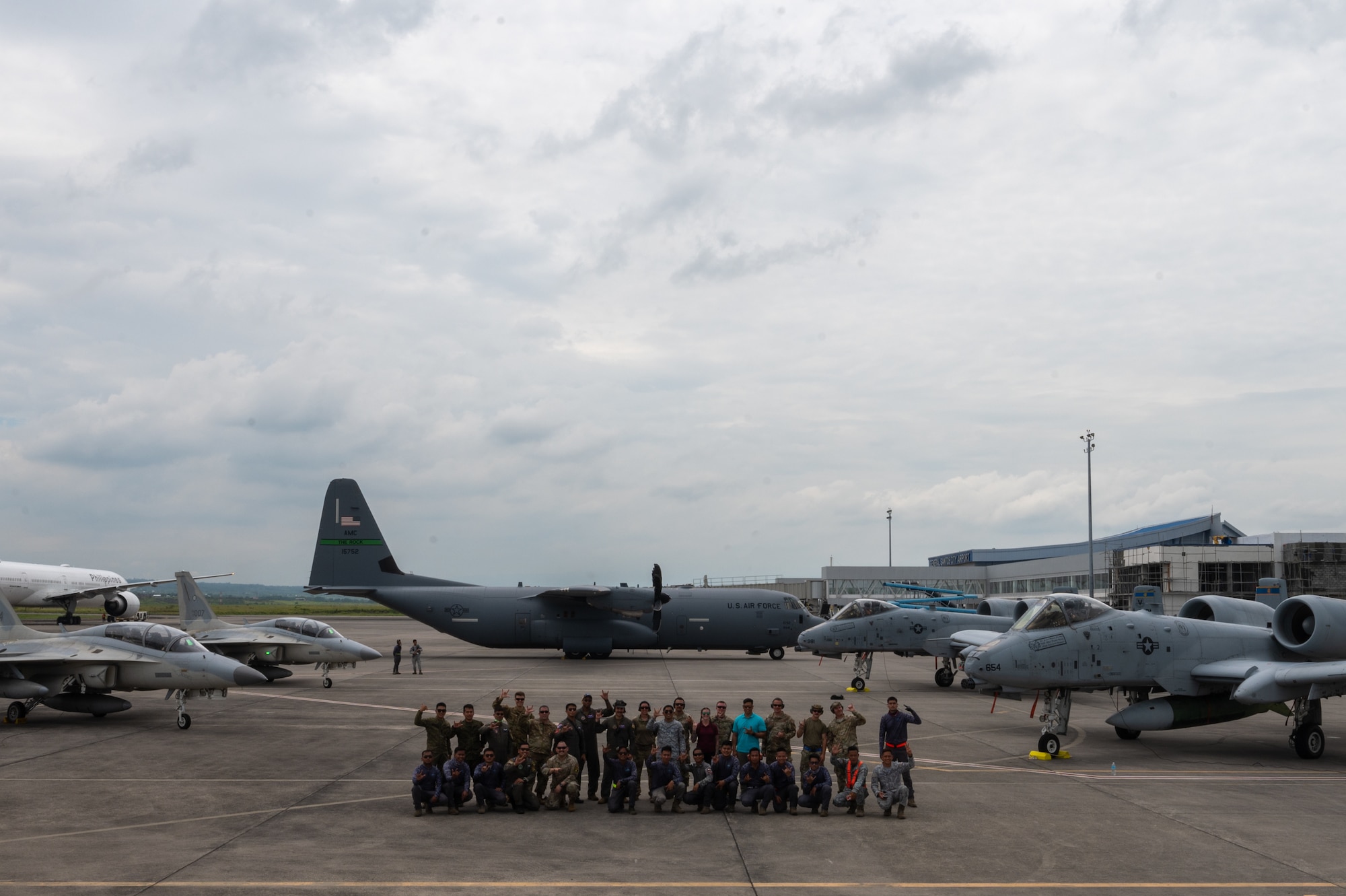 U.S. Air Force Airmen, assigned to Davis-Monthan Air Force Base, Arizona along with Philippine Air Force members pose for a group photo during Cope Thunder 23-2 at General Santos International Airport, Philippines, July 11, 2023. The movement to Gen Santos was one of the first times the U.S. leveraged agile combat employment capabilities successfully in the Philippines. (U.S. Air Force photo by Senior Airman Vaughn Weber)