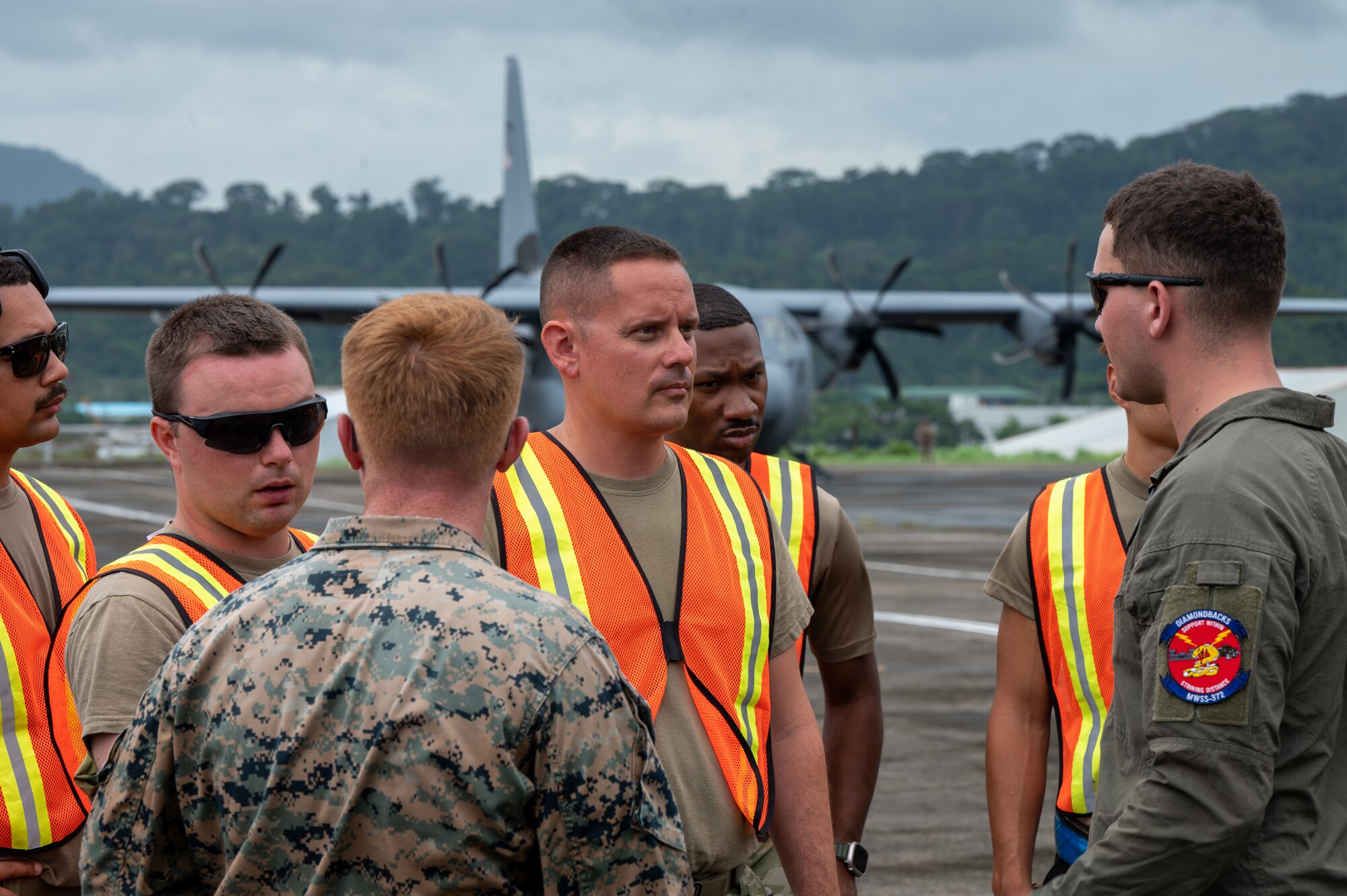 U.S. Air Force Airmen, assigned to Davis-Monthan Air Force Base, Arizona and Marine Corps Marines, assigned to Marine Wing Support Squadron 373, discuss fuel lines in support of Cope Thunder 23-2 at Subic Bay International Airport, Philippines, July 15, 2023. Cope Thunder 23-2 was an exercise that built relationships that bridged the language barrier and enhanced the U.S. and the Philippines’ collective ability to address the most pressing security challenges. (U.S. Air Force photo by Senior Airman Vaughn Weber)