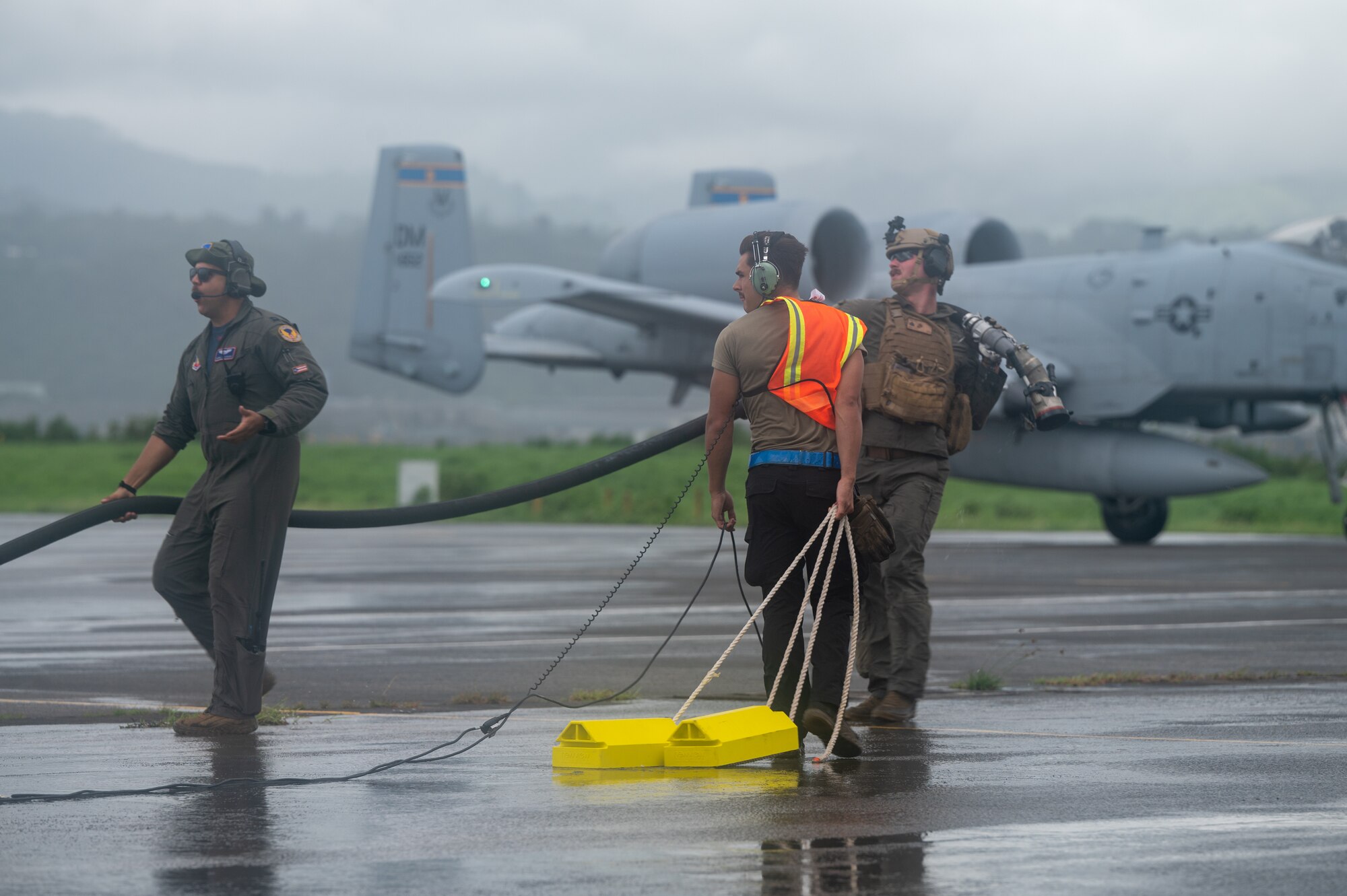 U.S. Air Force Airmen, assigned to Davis-Monthan Air Force Base, Arizona and Marine Corps Marines, assigned to Marine Wing Support Squadron 373, prepare to refuel an A-10C Thunderbolt II during a forward arming and refueling exercise for Cope Thunder 23-2 at Subic Bay International Airport, Philippines, July 15, 2023. Cope Thunder 23-2 provided valuable training to aircrews allowing joint foreign forces to work together and improve interoperability. (U.S. Air Force photo by Senior Airman Vaughn Weber)
