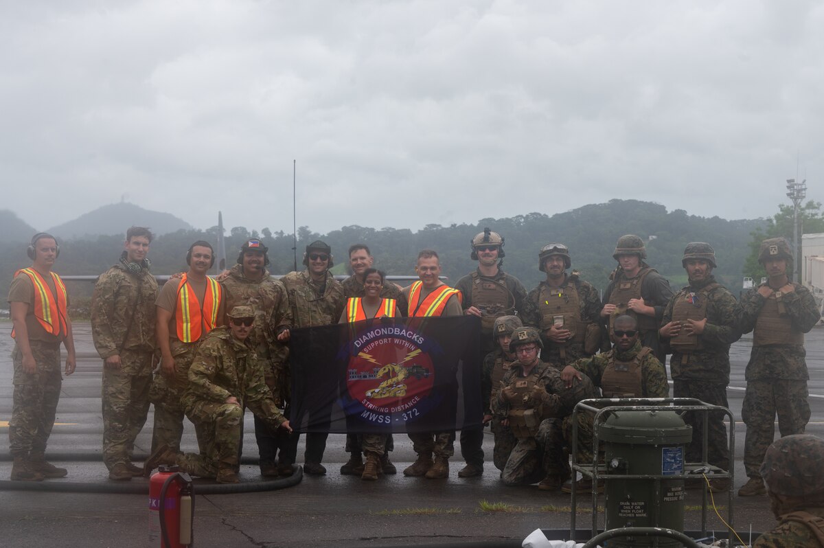 U.S. Air Force Airmen, assigned to Davis-Monthan Air Force Base, Arizona and Marine Corps Marines, assigned to Marine Wing Support Squadron 373, pose for a photo during Cope Thunder 23-2 at Subic Bay International Airport, Philippines, July 15, 2023. The objectives of Cope Thunder 23-2 were to plan for combined fighter operations, practice interoperability with tactical units and bolster the combat capability of participating nations. (U.S. Air Force photo by Senior Airman Vaughn Weber)