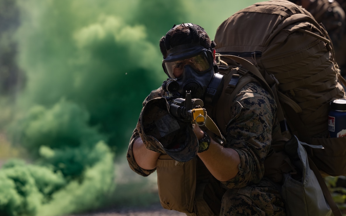 U.S. Marines participate in a simulated Chemical, Biological, Radiological, and Nuclear exercise during the Force Headquarters Group Super Squad Competition at Joint Base Elmendorf-Richardson, Alaska, July, 23, 2023. During the multi-day competition, reserve units from all across the Marine Corps, exercised their technical and tactical proficiencies by competing in events that highlighted offensive/defensive operations, patrolling techniques, combat marksmanship, physical endurance and small unit leadership.