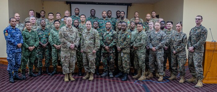 Multiple nations participating in the cyber security defense training pose for a group photo during Tradewinds 2023 in Georgetown, Guyana, July 26, 2023. Tradewinds is a U.S. Southern Command-sponsored exercise designed to strengthen partnerships and interoperability, promote human rights, as well as increase all participants training capacity and to mitigate, plan for and respond to crisis and security threats.