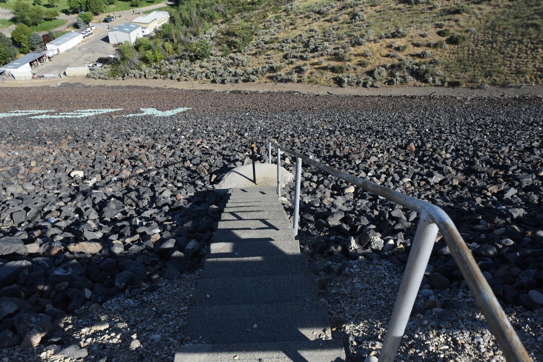 These staircases allow access to Lucky Peak’s piezometers, an essential component to dam safety at Lucky Peak Dam. A piezometer is a geotechnical instrument that measures changes of water level or water pressure beneath the surface. There are 25 piezometers specifically arranged at Lucky Peak Dam to gather risk assessment data for engineers. The piezometers extend to different lengths beneath the surface to measure water depth at specific locations.