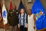 Retirees, Joyce Wilson and Sharon Mcintosh-Mason, pose with Defense Logistics Agency Troop Support Commander Army Col. Landis Maddox, after a ceremony in their honor. The two retired after a combined more than half-century of work with DLA Troop Support.