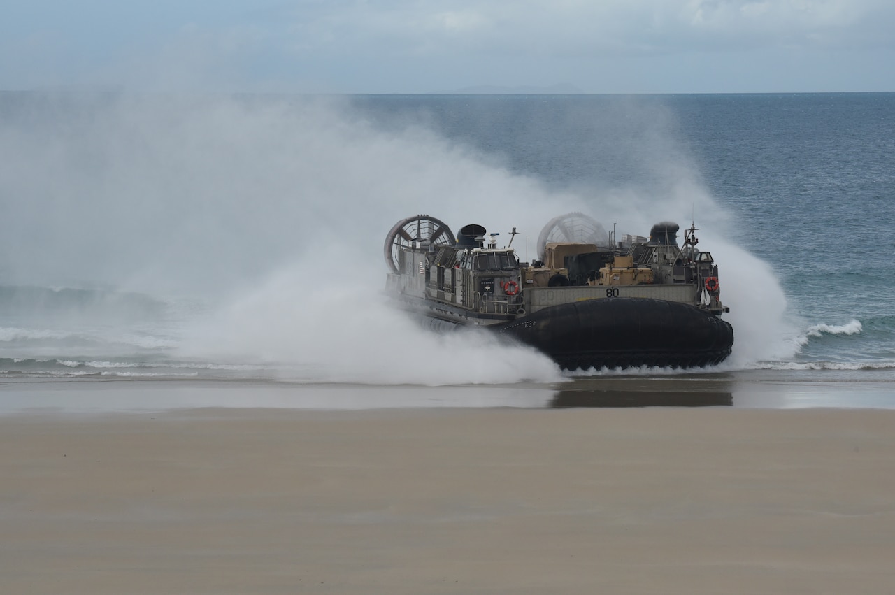 A military landing craft comes ashore.