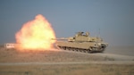 A 3rd Battalion, 116th Cavalry Regiment M1A2 SEPv2 Abrams Tank crew fires their 120 mm main gun as part of the battalion's table VI qualification at Orchard Combat Training Center near Boise, Idaho, July 23, 2023.