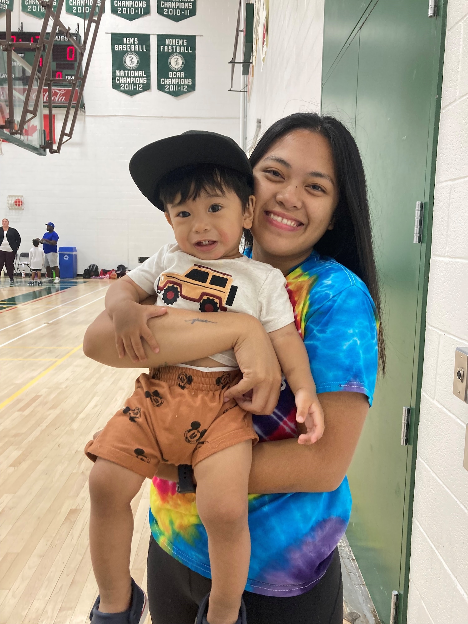 (Right to left) Image of Senior Airman Leanne Untivero, 931st Aerospace Medicine Squadron Medicine Squadron medical technician, holding her son.