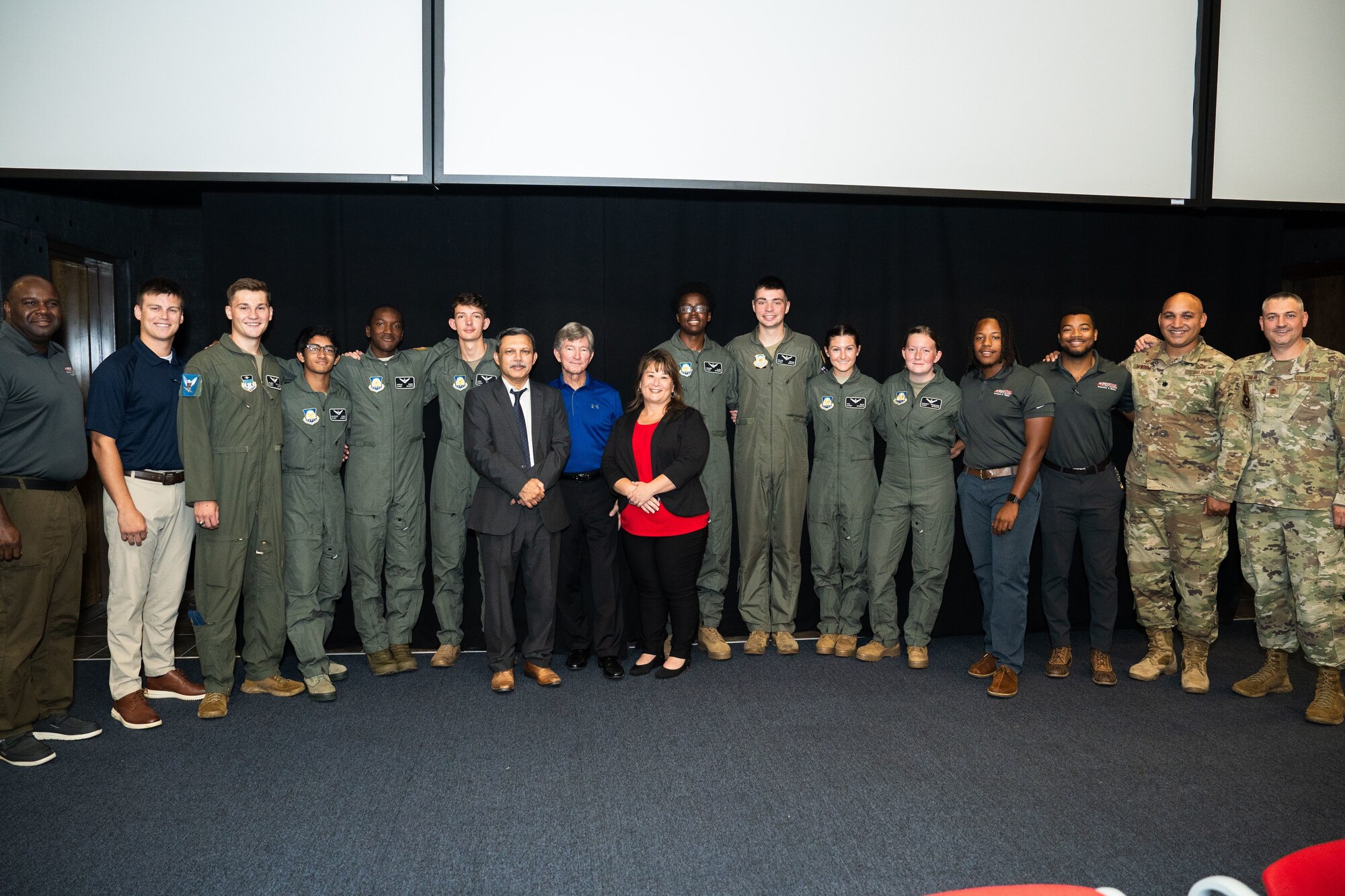 The AFJROTC Flight Academy graduates take a celebratory photo with AFJROTC staff, Detachment 015 cadre, faculty, and Red Tail Flight Academy flight instructor team