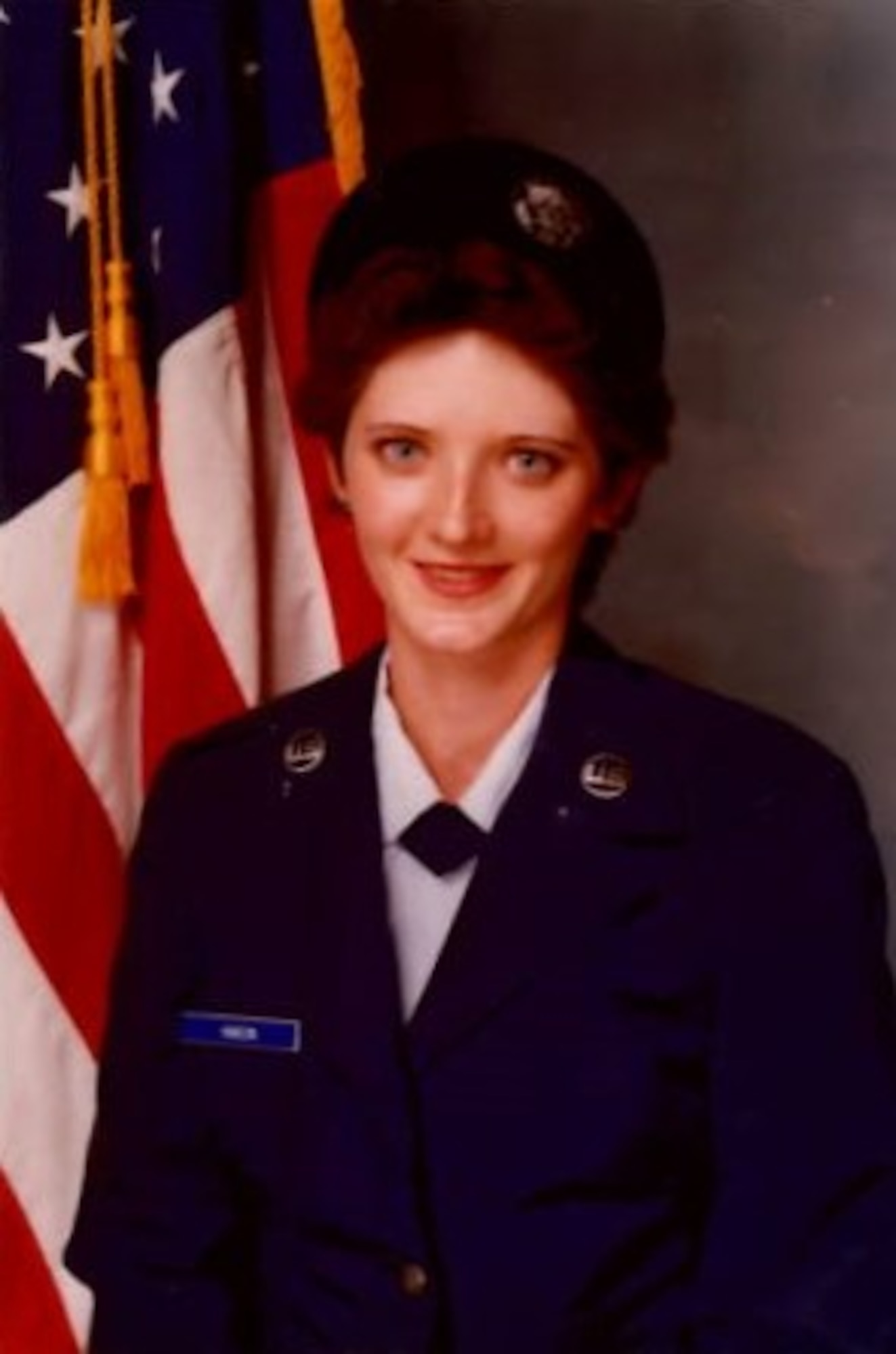 U.S. Air Force Col. David Morales, 62d Airlift Wing deputy commander, presents Pamela Best, electronic mechanic with the 62d Maintenance Squadron, with a certificate of service at Joint Base Lewis-McChord, Washington, July 26, 2023. Best joined the Air Force in 1983 as an avionic inertial RADAR navigation specialist. This month she celebrates 40 years of combined duty and civilian service with the Air Force. (U.S. Air Force photo by Airman 1st Class Kylee Tyus)