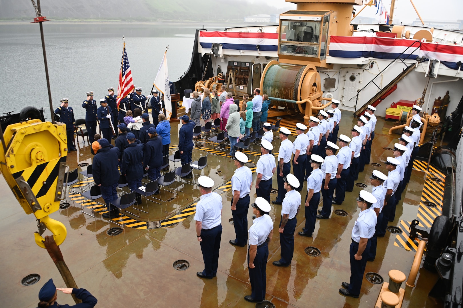 Coast Guard Cutter Cypress personnel stand at attention during a change-of-command ceremony held at Base Kodiak in Kodiak, Alaska, Aug. 3, 2023. Base Kodiak is the largest land installation of the Coast Guard and serves as the senior Mission Support touchstone for Coast Guard operations within the 17th District across Alaska, standing shoulder-to-shoulder with its operational partners to ensure the delivery of professional, responsive and cost-effective services to the American public. U.S. Coast Guard photo by Petty Officer 3rd Class Ian Gray.