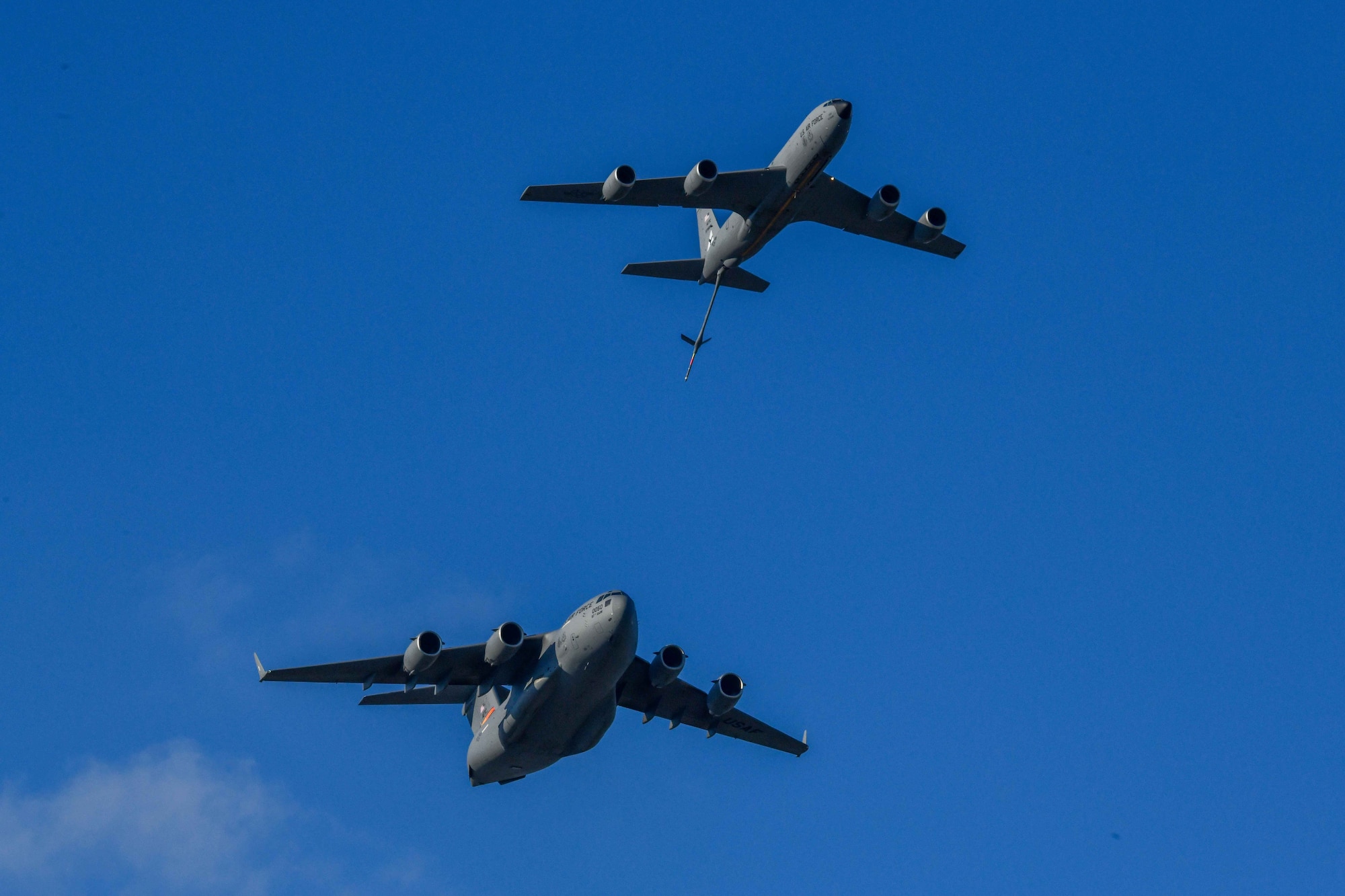 A KC-135 Stratotanker and C-17 Globemaster III from Altus Air Force Base, Oklahoma, demonstrate air refueling during the 2023 Experimental Aviation Association AirVenture Air Show in Oshkosh, Wisconsin, July 29, 2023. The demo team performed several maneuvers including landing attitude and refueling demonstrations. (U.S. Air Force photo by Airman 1st Class Karalyn Degraffenreed)