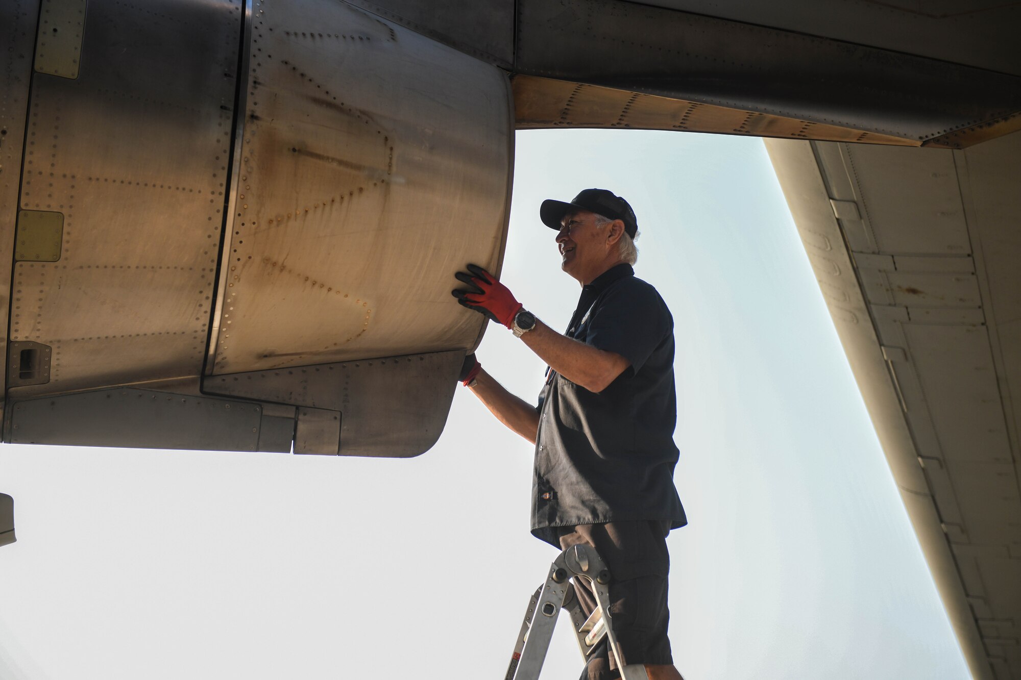 Jay Chase, 97th Aircraft Maintenance Squadron aircraft technician, inspects the engine of a C-17 Globemaster III prior to takeoff in Oshkosh, Wisconsin, July 31, 2023. Aircraft technicians are responsible for performing functional checks, inspections and maintenance before, during and after flights. (U.S. Air Force photo by Airman 1st Class Miyah Gray)