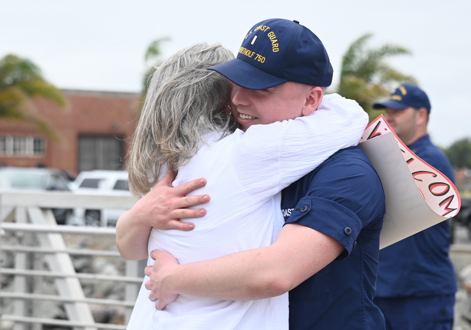 A Coast Guard Cutter Bertholf (WMSL 750) crew member hugs his mom after the cutter and crew returned to homeport in Alameda, Calif., Aug. 3, 2023. The Bertholf and crew deployed for 120-days for a Bering Sea patrol in support of United States national security, U.S. fishing fleet safety and prosperity, and the protection of U.S. living marine resources. (U.S. Coast Guard photo by Senior Chief Petty Officer Charly Tautfest)