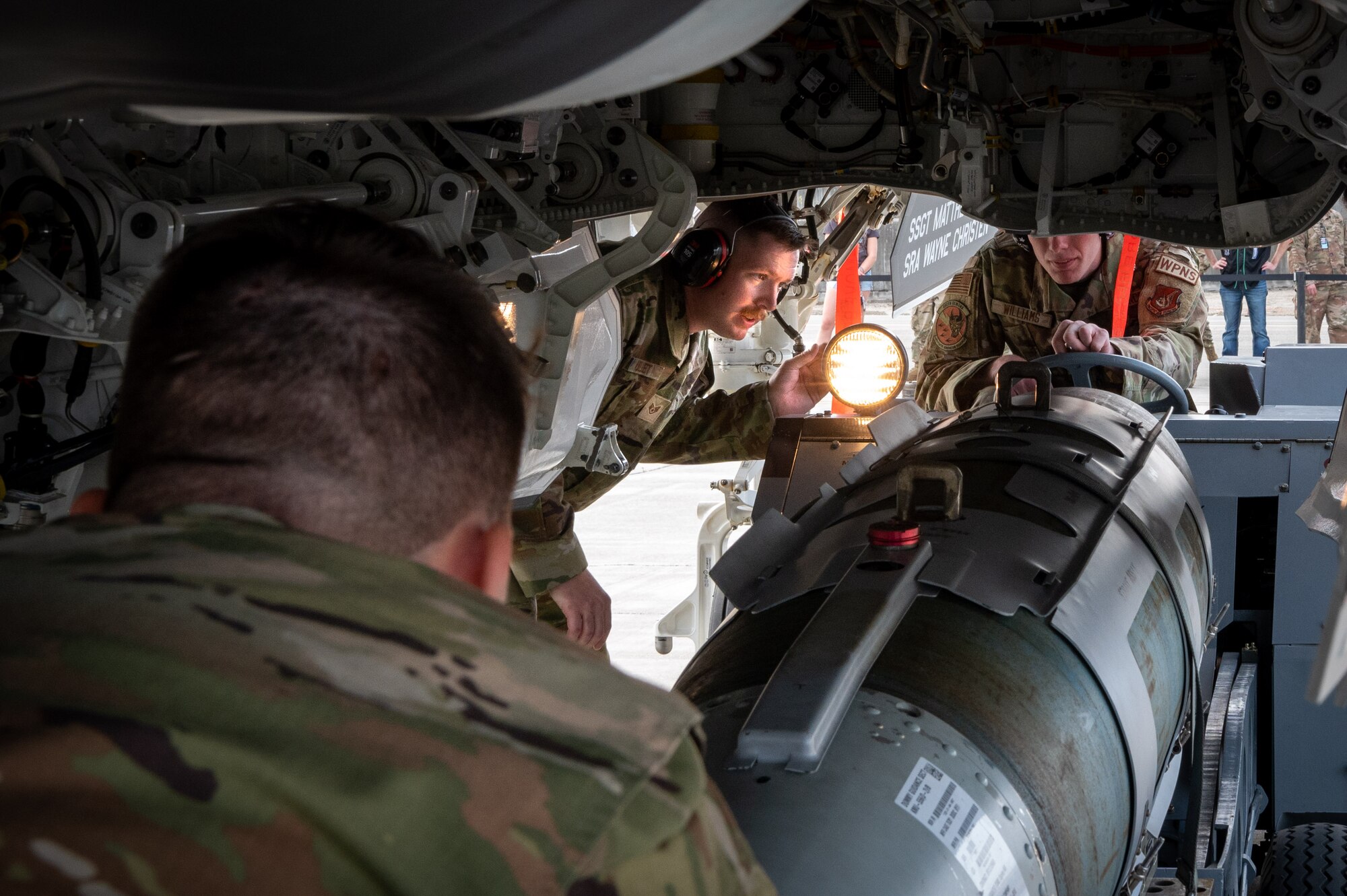 Weapons load crew team assigned to 356th Fighter Generation Squadron, Eielson AFB, loads ordnance during load competition, at JBER, July 28, 2023
