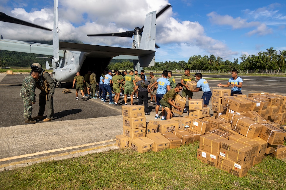 U.S. Marines with Marine Medium Tiltrotor Squadron (VMM) 163 (Reinforced), Marine Aircraft Group 16, 3rd Marine Aircraft Wing, and Philippine Marines offload food and water, provided by the Government of the Philippines, from an MV-22B Osprey while conducting relief efforts in the wake of Typhoon Egay, international name Typhoon Doksuri, in Basco, Batanes province, Philippines, July 31, 2023. At the request of the Armed Forces of the Philippines, U.S. Marines are providing relief and lifesaving capabilities to remote regions of the Philippines. The forward presence and ready posture of I Marine Expeditionary Force assets in the region facilitated rapid and effective response to crisis, demonstrating the U.S.’s commitment to Allies and partners during time of need. During the first day of relief efforts, VMM-163 (Rein.) delivered approximately 12,000 pounds of food and water, provided by the Government of the Philippines, to a remote Philippine island in need. (U.S. Marine Corps photo by Cpl. Sean A. Potter)