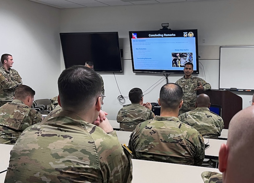 Lt. Col. Mohammed Rashed, front right, welcomes members of the U.S. Army Reserve, U.S. Futures Command, and the U.S. Army’s XVIII Airborne Corps during the first day of a Code-A-Thon on Joint Reserve Base Ellington Field, Texas. The 75th Innovation Command hosted the Code-A-Thon, an eight-day event that began July 17, 2023. The event was to build planning for technology-based capabilities for the Army by leveraging the Army Reserve Soldiers’ civilian expertise, such as generative artificial intelligence and data science. (U.S. Army photo by Maj. Charles An)